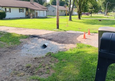 An angle highlighting the culvert under a freshly laid asphalt.